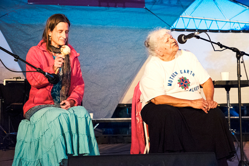 Ele-Elleid (left) and Maryellen Baker (right), an Anishinaabe Elder from the Lac Courte Oreilles Reservation in Wisconsin and founder of a Cultural Healing Center called Abiinooji-Aki (Children’s Land). This photo was taken at The Times of the Purification Gathering on Mother’s Day when Maryellen led a Women and Water Honoring and Healing Ceremony.