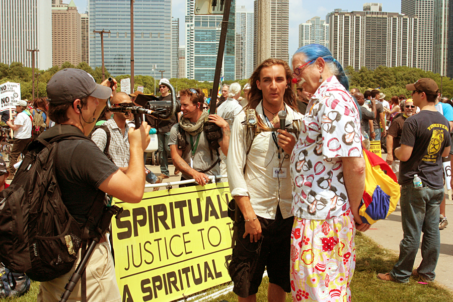 Filming Amadon DellErba of Global Change Multi-Media interviewing Dr. Patch Adams in Chicago at the NATO protest, May 2012. Photo by Global Change Media.
