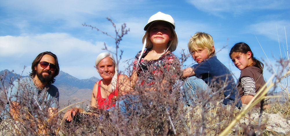 Ministers Ionia and Kazarian romping in the mountains with some of the children.